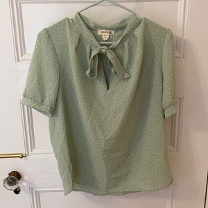 Green polka dotted blouse